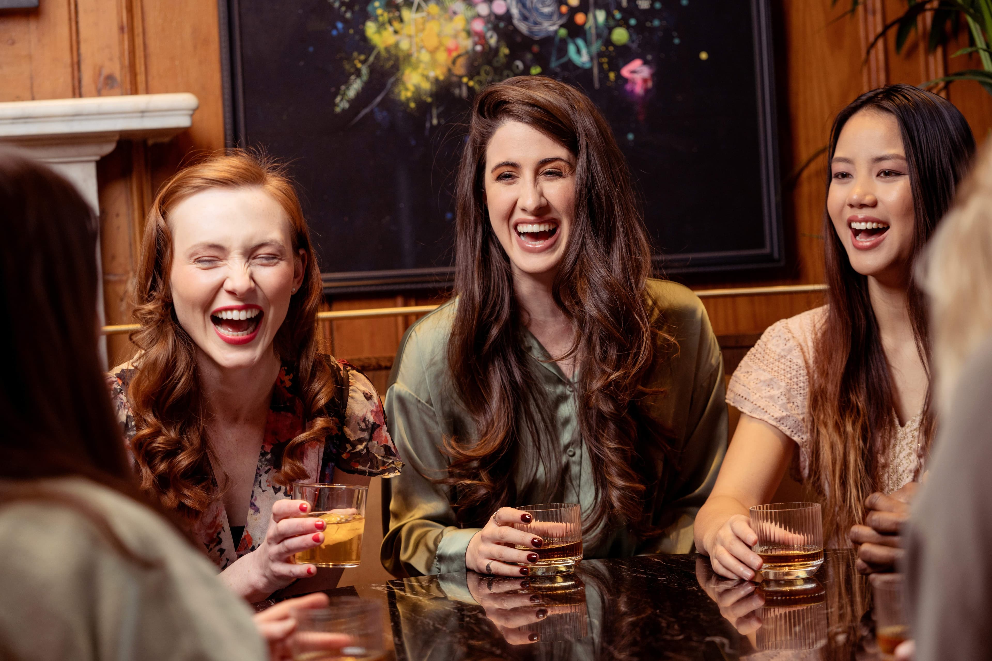 Women connecting authentically over drinks