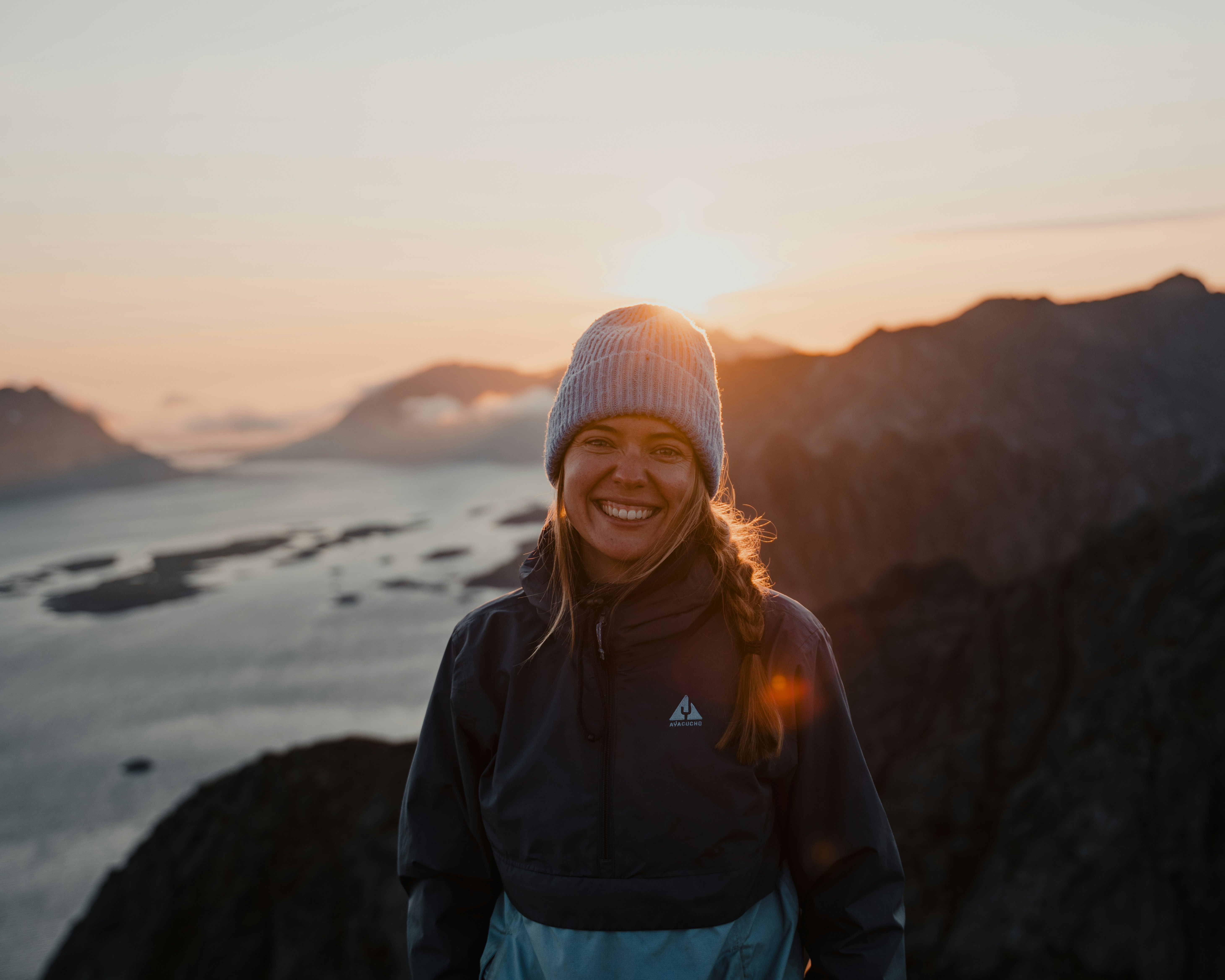 Woman enjoying coastal adventure at sunset